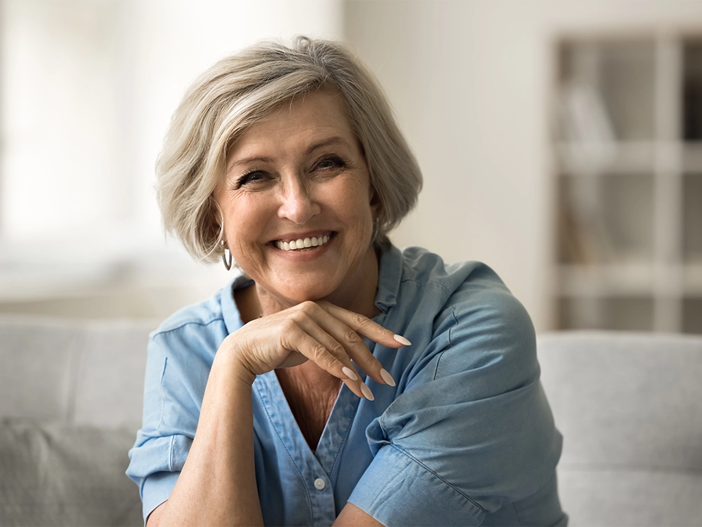 happy pretty stylish senior woman looking at camera smiling